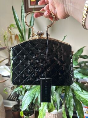 La Terre Black Patent Quilted Top-Handle Clutch